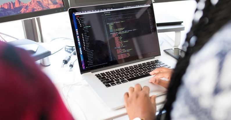 Development - Person Using Silver Macbook Pro