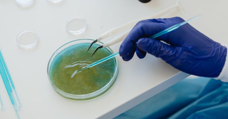Testing Tools - Person Holding Blue Thread on White Table