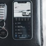 App Lifecycle - A smart phone and key fob on a black leather couch