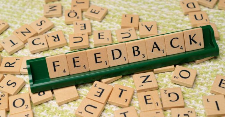 User Feedback - The word feedback is spelled out with scrabble tiles