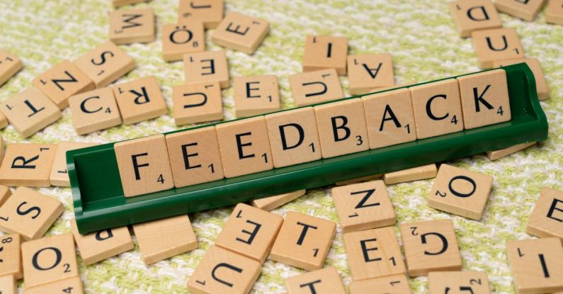 User Feedback - The word feedback is spelled out with scrabble tiles