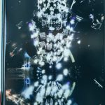 Web Apps - Crop person hand holding modern mobile phone with various apps and illuminated city on wallpaper