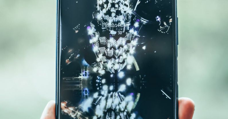 Web Apps - Crop person hand holding modern mobile phone with various apps and illuminated city on wallpaper