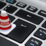 Data Protection - White Caution Cone on Keyboard
