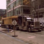 Autonomous Vehicles - A truck is driving down a city street