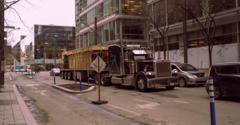 Autonomous Vehicles - A truck is driving down a city street