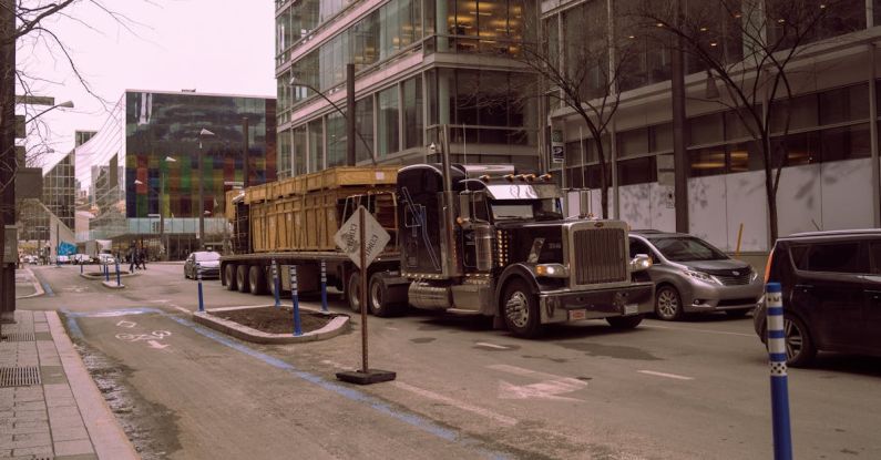Autonomous Vehicles - A truck is driving down a city street