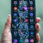 Web Apps - Crop person holding modern mobile phone